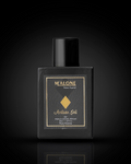Black perfume bottle with gold label on a black background